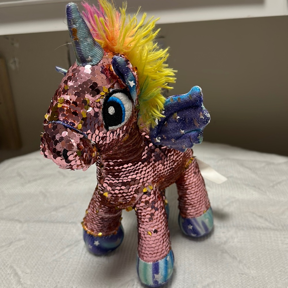 Fiesta reversible sequin pattern pink to gold rainbow/tie dye stuffed unicorn